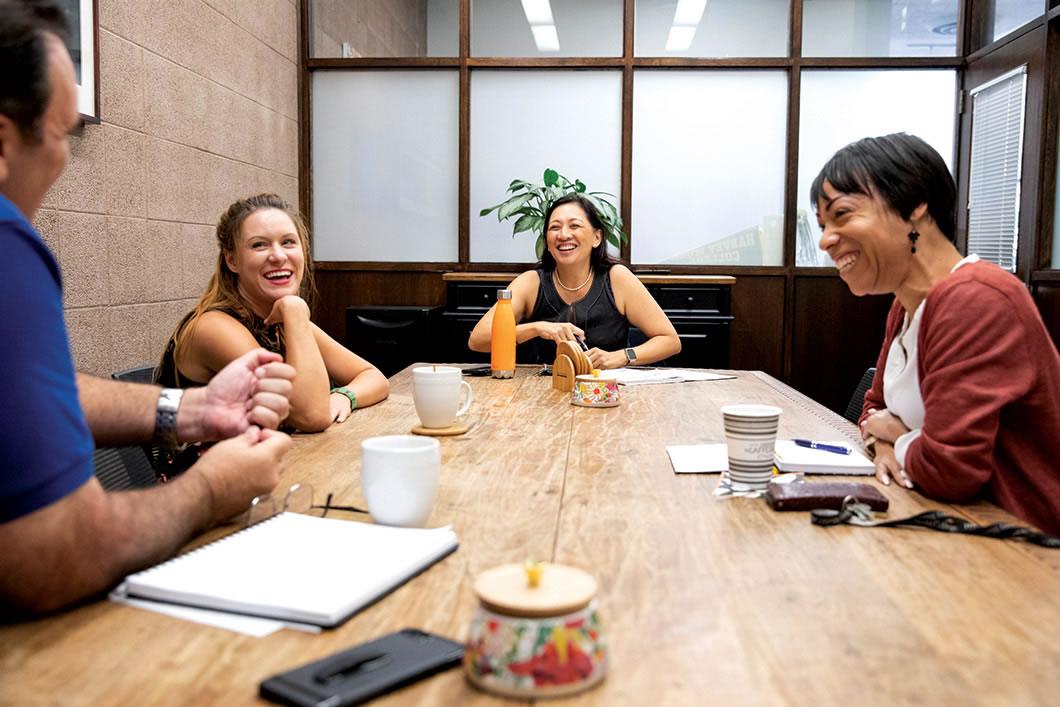 Anna Gonzalez heads table with other staff.