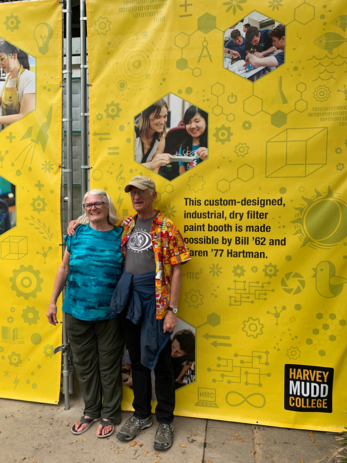 Karen and Bill Hartman in front of booth.