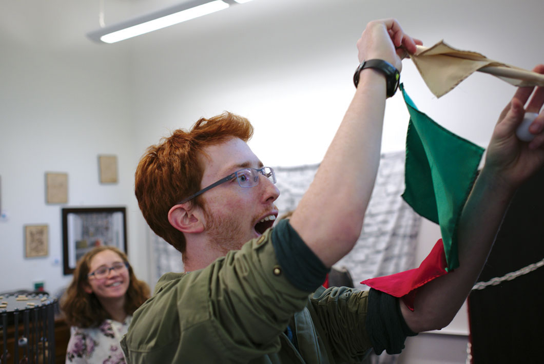 Student attaches flags to puzzle