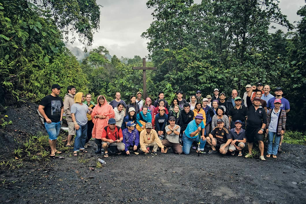 Group pose in forest.