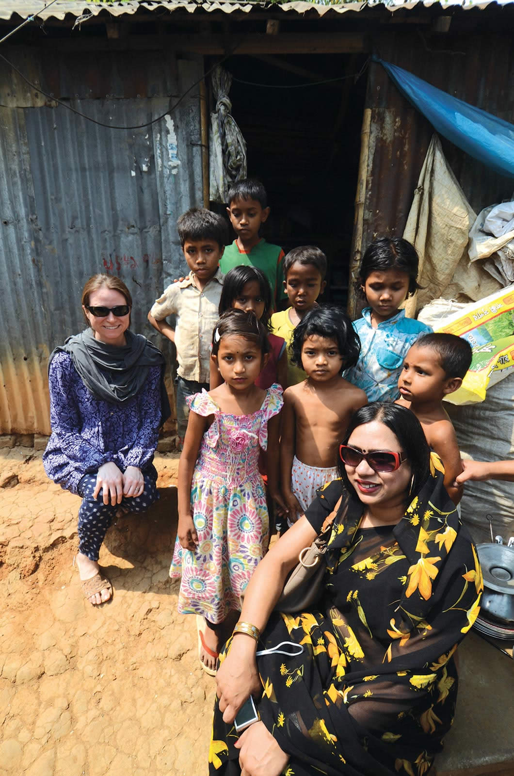 Of her work studying the brains of children, Perdue says, “I was attracted to the focus on social impact.” Here she poses with members of the community where her study takes place.