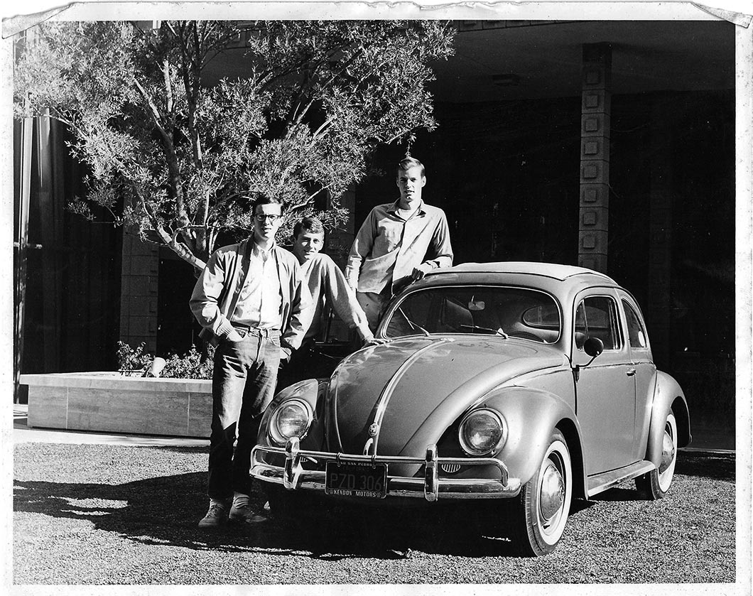 Dennis Rich ’66, Gary Jahns ’66 and Wolfgang Pflaum ’66 pose with VW Beetle.