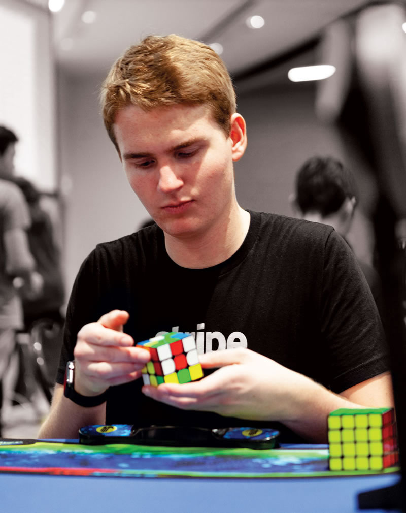 Adam Walker solves a Rubik cube.