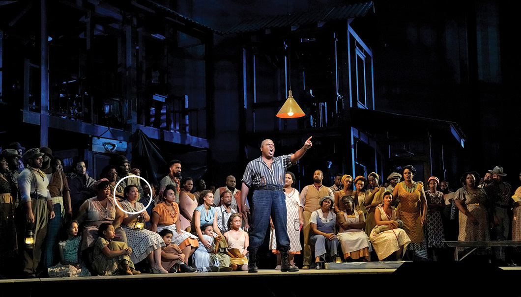 An actor at center stage performs a role in Porgy and Bess at the MET