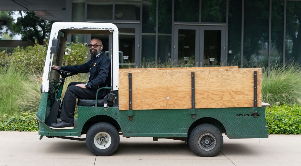 Travis Paddock in maintenance cart